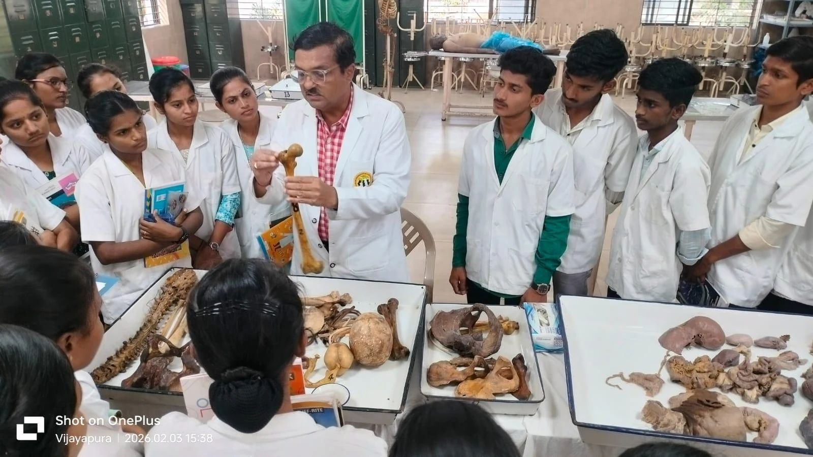First Semester BSc Nursing students BLDEA Jamkhandi observing human organ specimens and anatomical structures on dissection table at Shri BM Patil Medical College Vijayapura