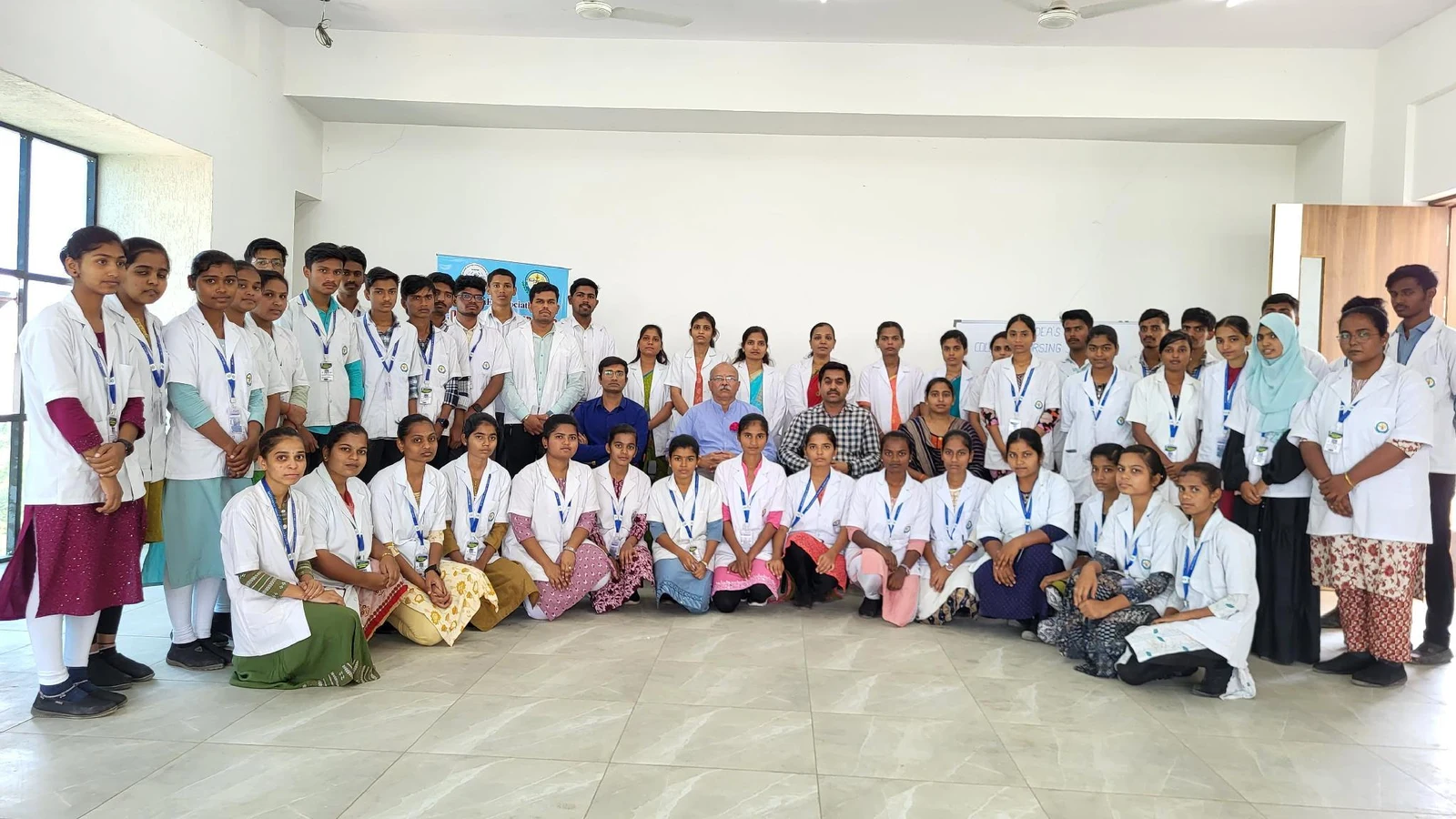 Group photo of Dr Veeranna S Jatti chief guest Dr Shankar Teli Ms Sujatha Biradar faculty from BLDEA College of Pharmacy Dr Veerabhadrappa G Mendagudli Principal and all first semester BSc Nursing students of BLDEAS College of Nursing Jamkhandi after Anatomy and Physiology Model Exhibition March 21 2025