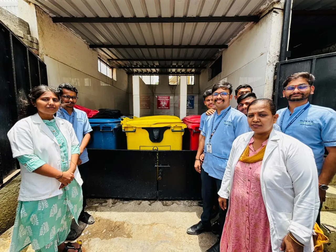 Hospital staff demonstrating safe collection and handling of biomedical waste to nursing students Vijayapura
