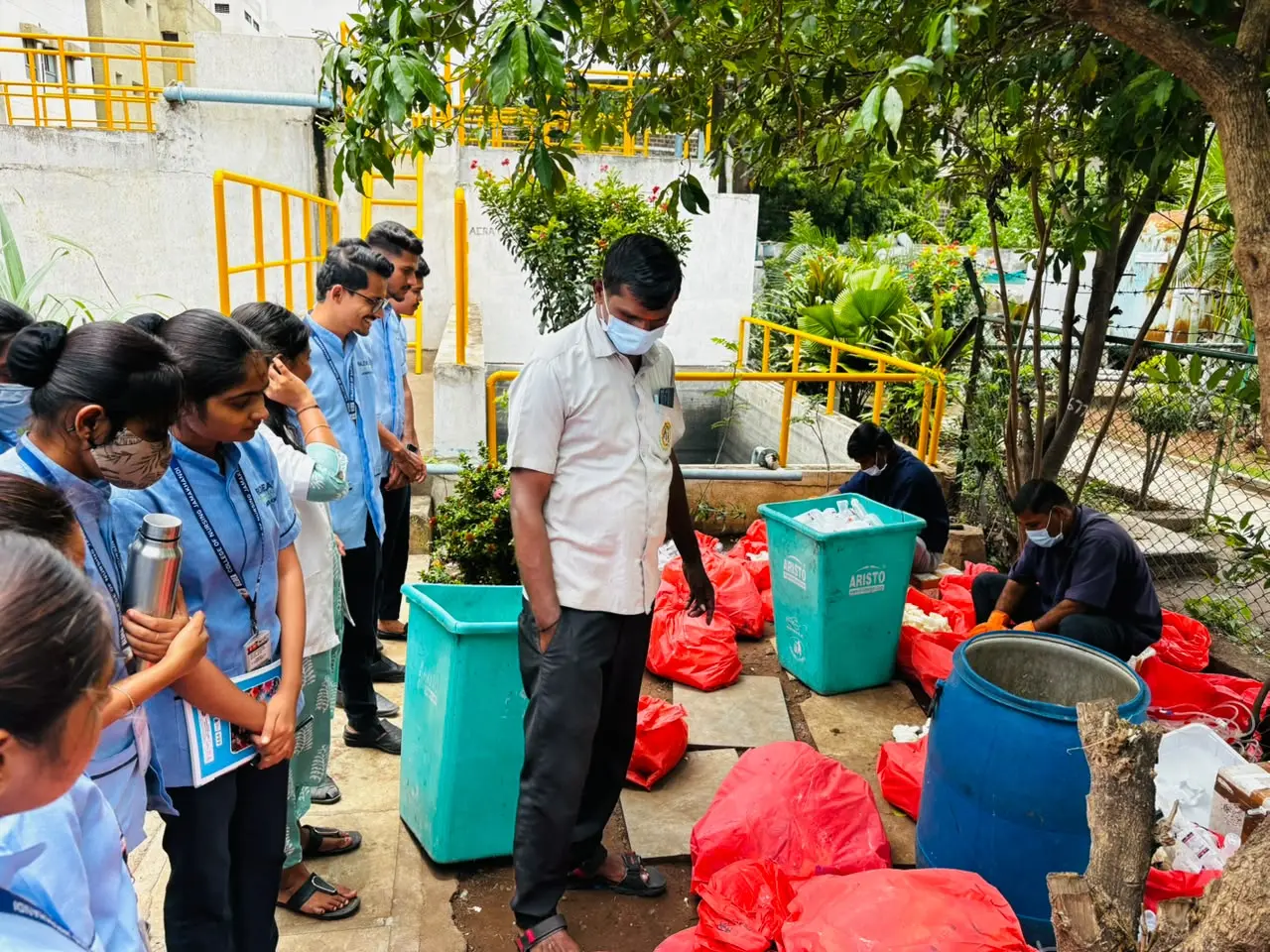 Nursing students listening to explanation on biomedical waste categories at Biomedical Waste Management Unit Vijayapura July 2026