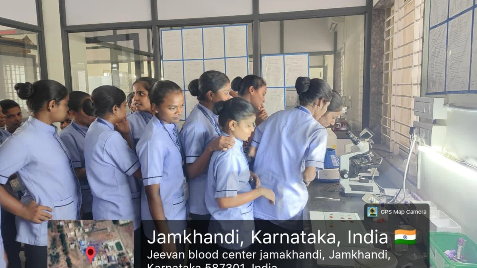 B.Sc. Nursing students observing laboratory microscopes at Jeevan Blood Bank Centre Jamkhandi
