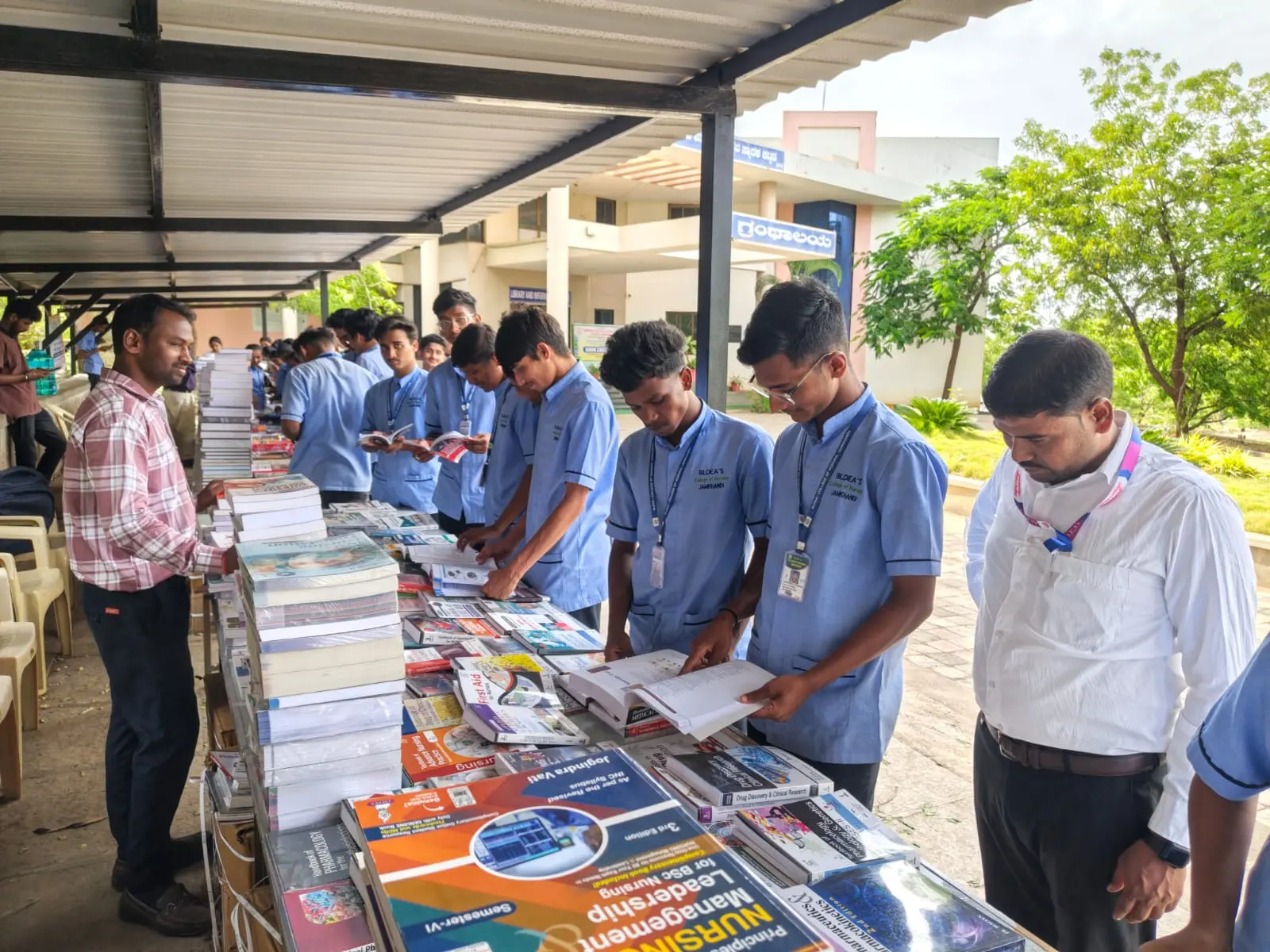 Students browsing books at Book Exhibition organized by BLDEA College of Nursing at BLDE Central Library Jamkhandi August 2026