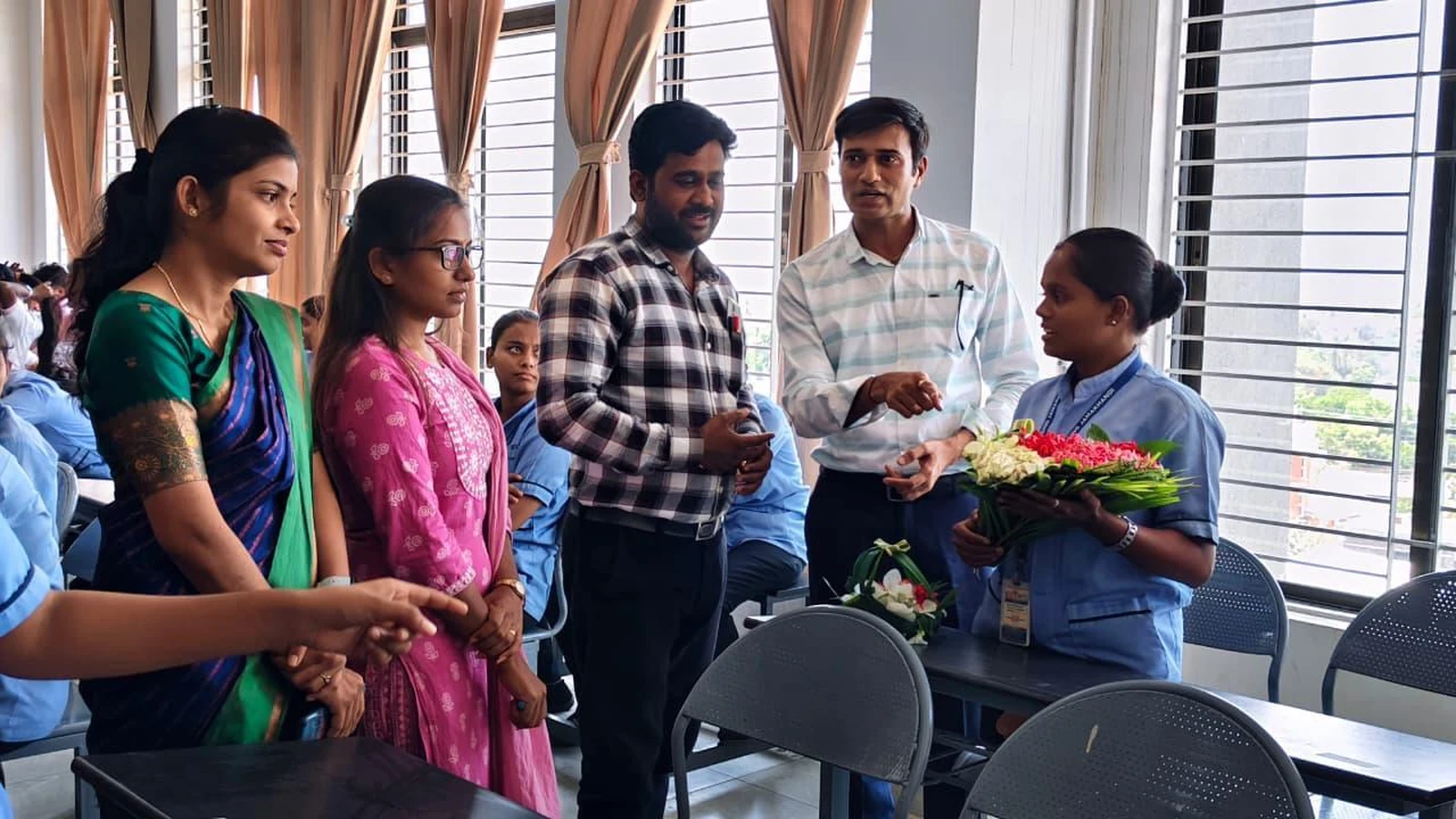 Judges evaluating bouquet entries at Intercollegiate Bouquet Making Competition 2026 – BLDEA College of Nursing Jamkhandi