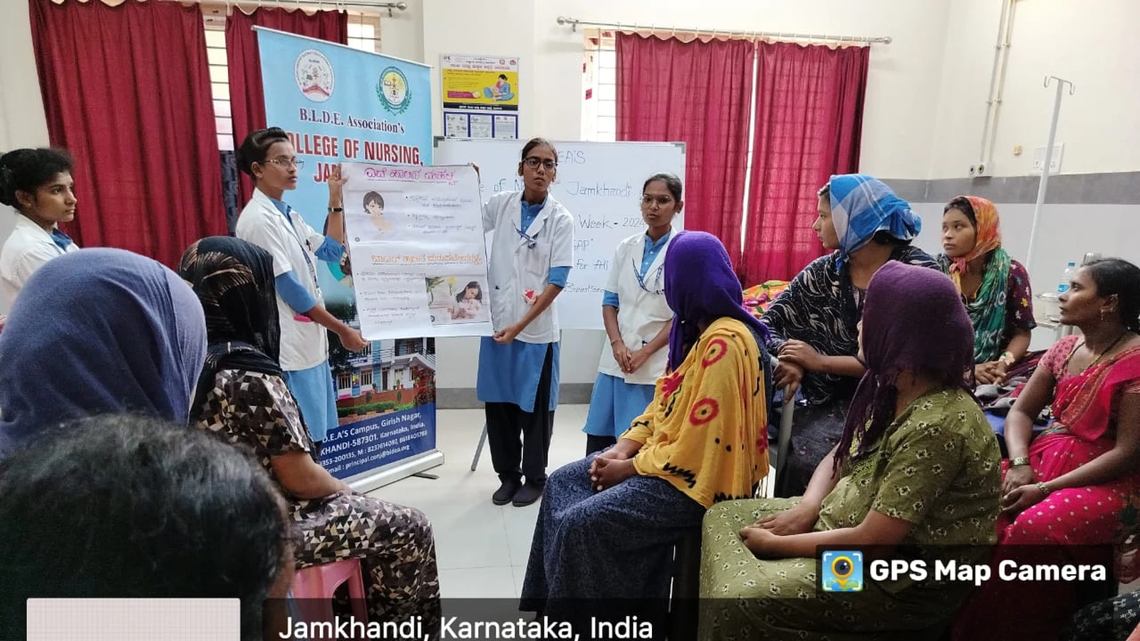 BSc Nursing student of BLDEAS College of Nursing Jamkhandi presenting breastfeeding awareness information to antenatal and postnatal mothers seated at Taluka Hospital Jamkhandi during World Breastfeeding Week August 6 2024
