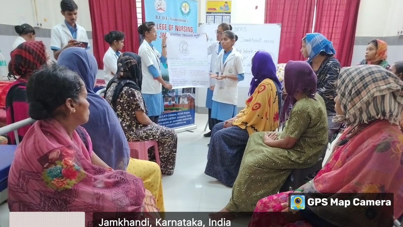 BSc Nursing students of BLDEAS College of Nursing Jamkhandi conducting breastfeeding awareness education session for antenatal and postnatal mothers at Taluka Hospital Jamkhandi during World Breastfeeding Week August 6 2024 with BLDEAS College of Nursing rollup banner visible in background