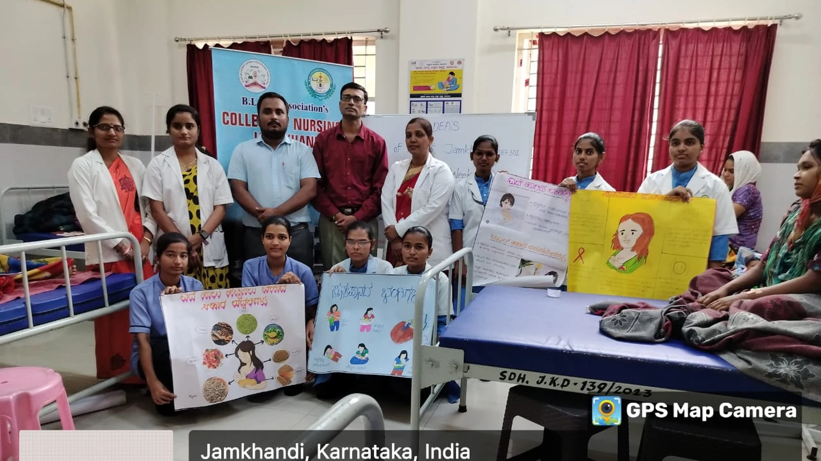 Mr Somesh Nikkam PG Nursing Tutor and BSc Nursing students of BLDEAS College of Nursing Jamkhandi holding educational charts and posters for group photograph at conclusion of breastfeeding awareness program during World Breastfeeding Week at Taluka Hospital Jamkhandi August 6 2024
