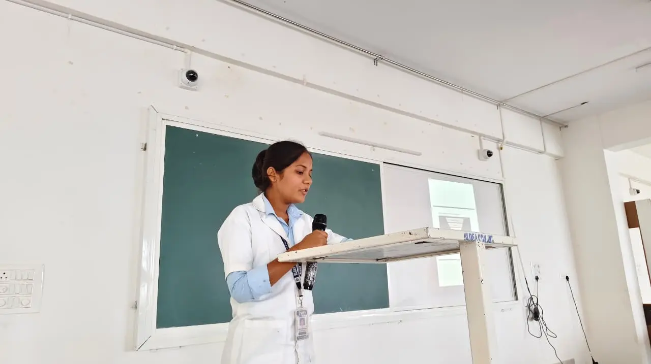 Seventh Semester nursing student presenting day wise Community Health Nursing posting report to audience BLDEA College of Nursing