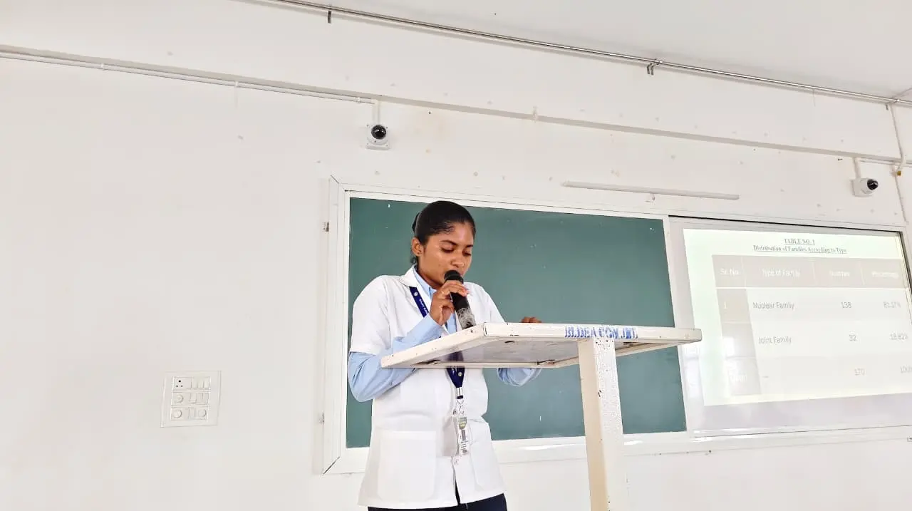 Nursing students presenting slides on Anganwadi and school health programmes conducted during CHN posting Kakanwadi village