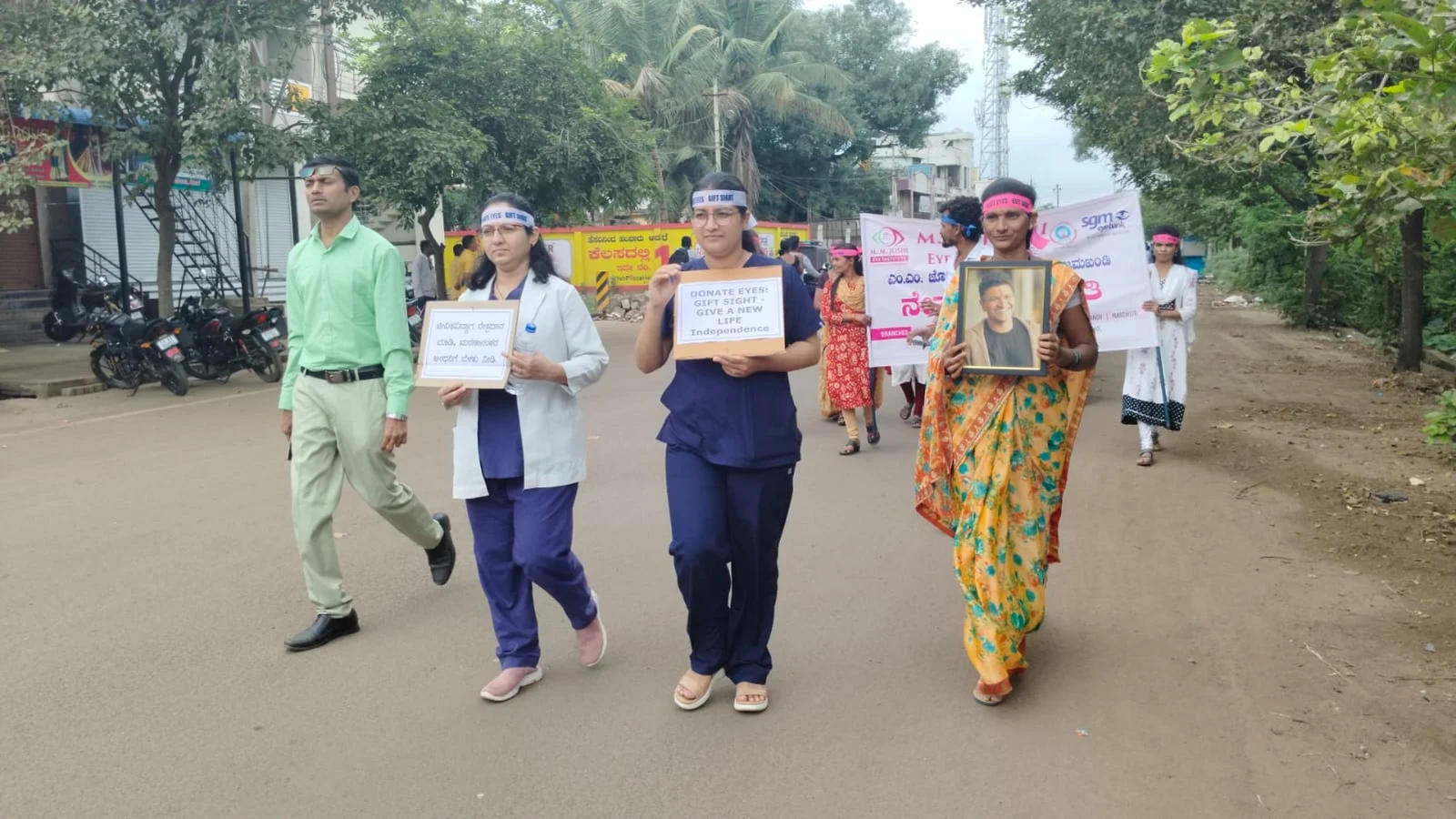 Faculty and staff of BLDEAS College of Nursing Jamkhandi and MM Joshi Eye Institute marching with placards and awareness materials during Eye Donation Awareness Rally National Eye Donation Week September 4 2024 through Jamkhandi town