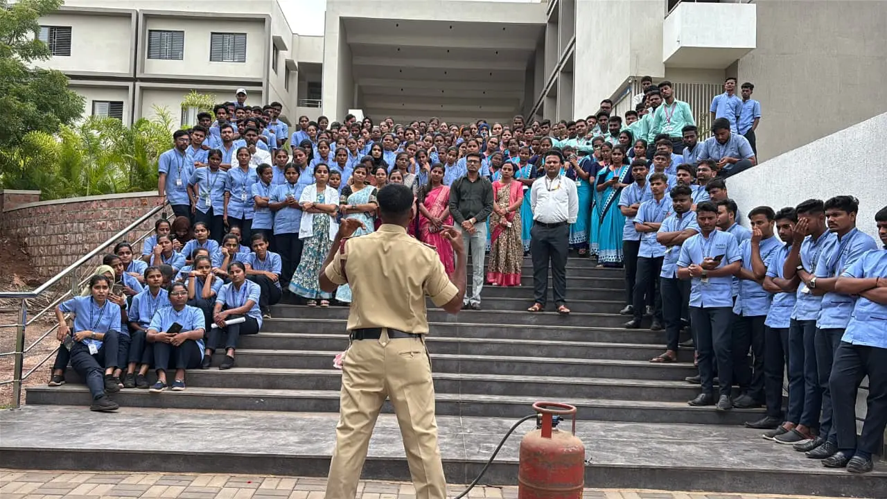 Fire safety mock drill demonstration with fire hose in progress at BLDEA College of Nursing Jamkhandi July 2026