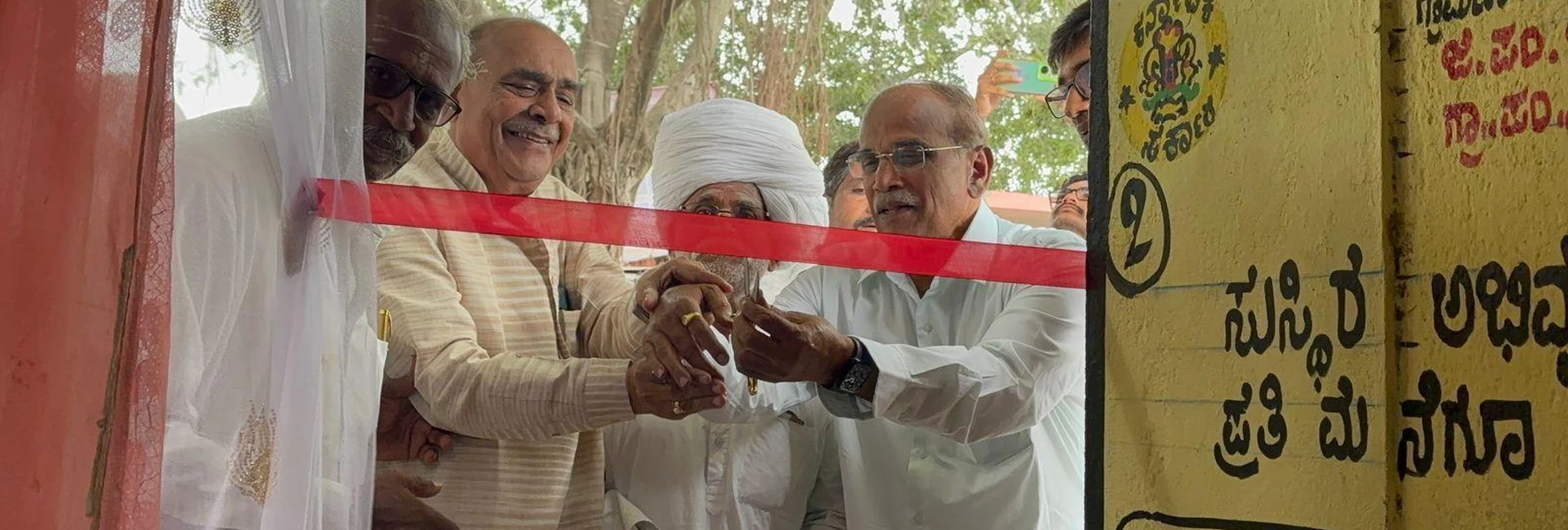 Prof SH Lagali Administrative Officer BLDE Association Jamkhandi and dignitaries cutting ribbon at inauguration of free health check-up camp organized by BLDEAS College of Nursing Jamkhandi in collaboration with Shri BM Patil Medical College Vijayapura at Mareguddi village Karnataka August 1 2025