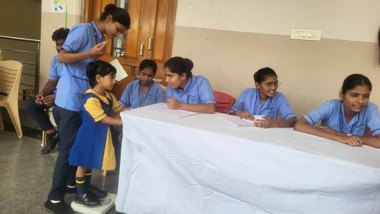 Nursing students providing health counselling and hygiene education to school children Jamkhandi free health camp 2026