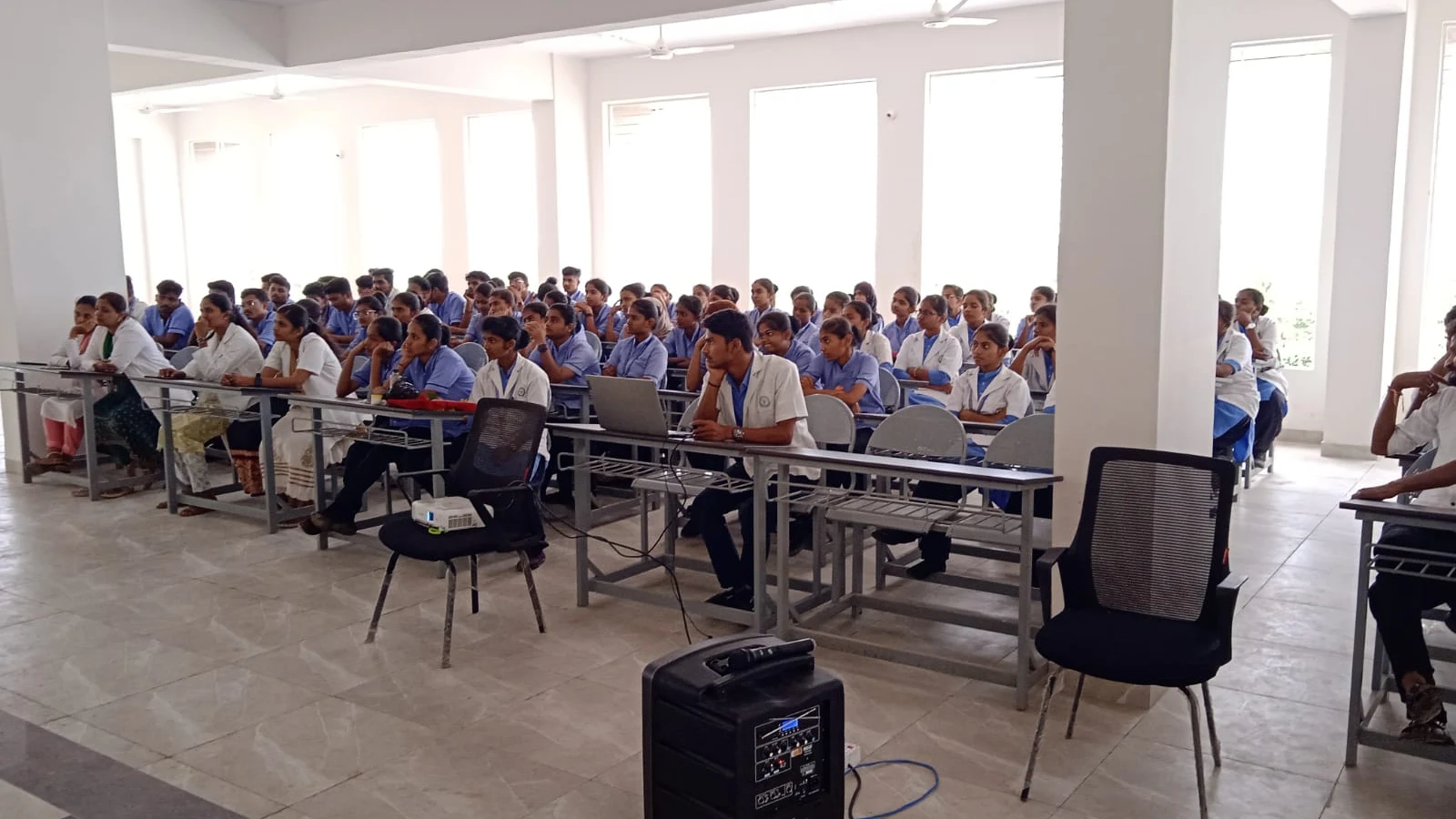 BLDEAS College of Nursing Jamkhandi students and faculty in blue nursing uniforms attending Guest Lecture on Eye Care and Eye Donation Awareness by Dr Deepa Udagatti in Seminar Hall on National Eye Donation Week September 4 2024 Jamkhandi with 97 participants present