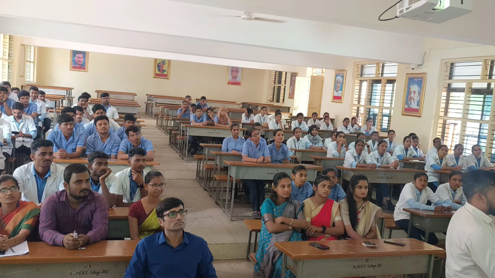 BSc Nursing students and faculty members of BLDEAS College of Nursing Jamkhandi attending guest lecture on Building Resilience Strategies for Suicide Prevention and Stress Management by Mr Prashant Bevoor Psychiatric Registered Nursing Officer DIMHANS Dharwad at Seminar Hall BLDEAS College of Nursing Jamkhandi on September 21 2024 with students seated at classroom desks and faculty in front row