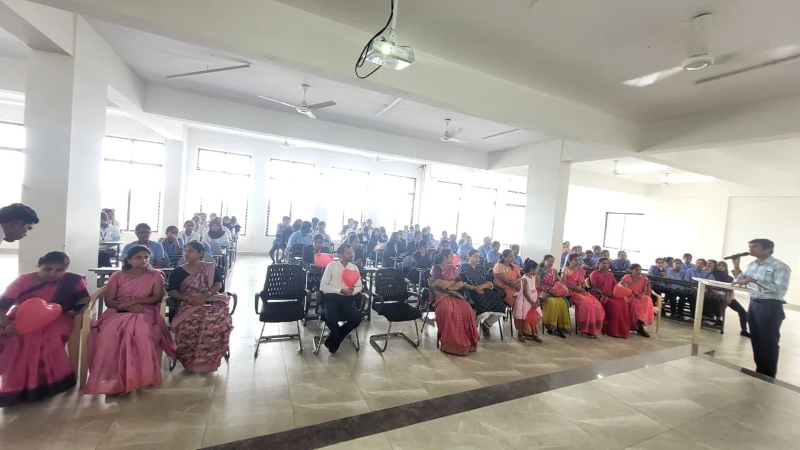 Wide view of BLDE BBA Jamkhandi staff and students seated as participants at hands-on CPR training session organized by BLDEAS College of Nursing Jamkhandi on World Heart Day September 30 2025 in large seminar hall