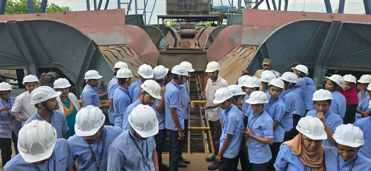 Students at cogeneration unit with safety helmets – Industrial Visit 2026, BLDEA College of Nursing Jamkhandi