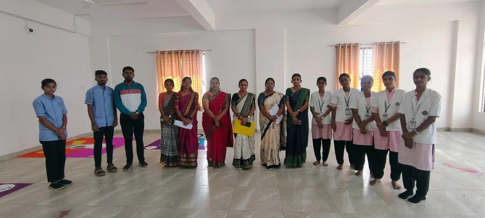 Group photo of all participants, judges, and faculty at Intercollegiate Rangoli Competition 2026 – BLDEA College of Nursing Jamkhandi