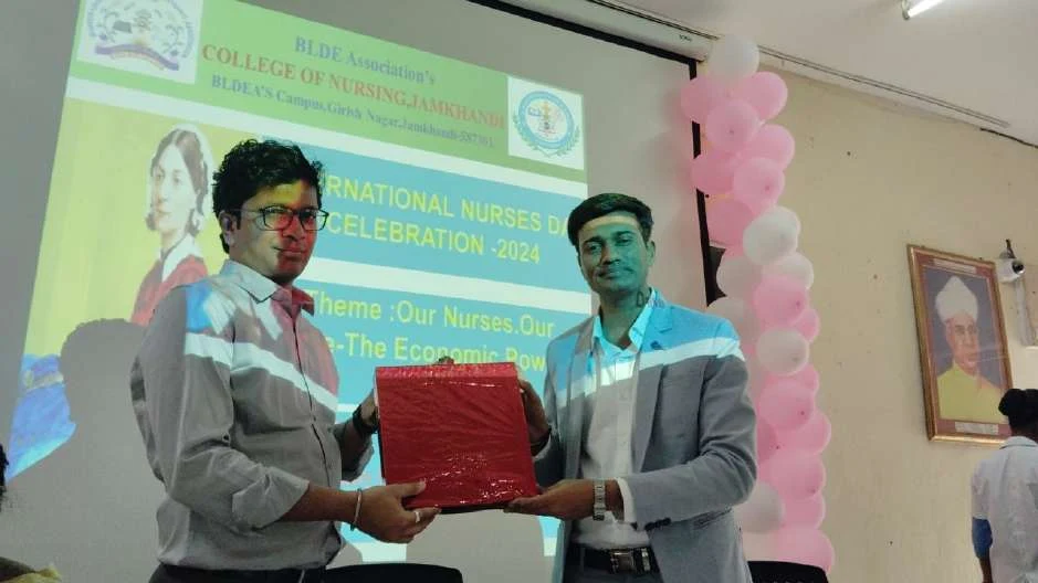 Presentation to guest on stage – International Nurses Day 2024, BLDEA College of Nursing Jamkhandi