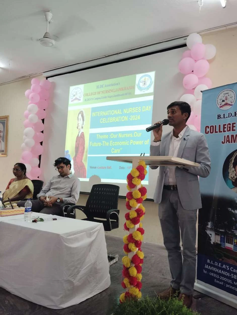 Speaker addressing at podium – International Nurses Day 2024, BLDEA College of Nursing Jamkhandi