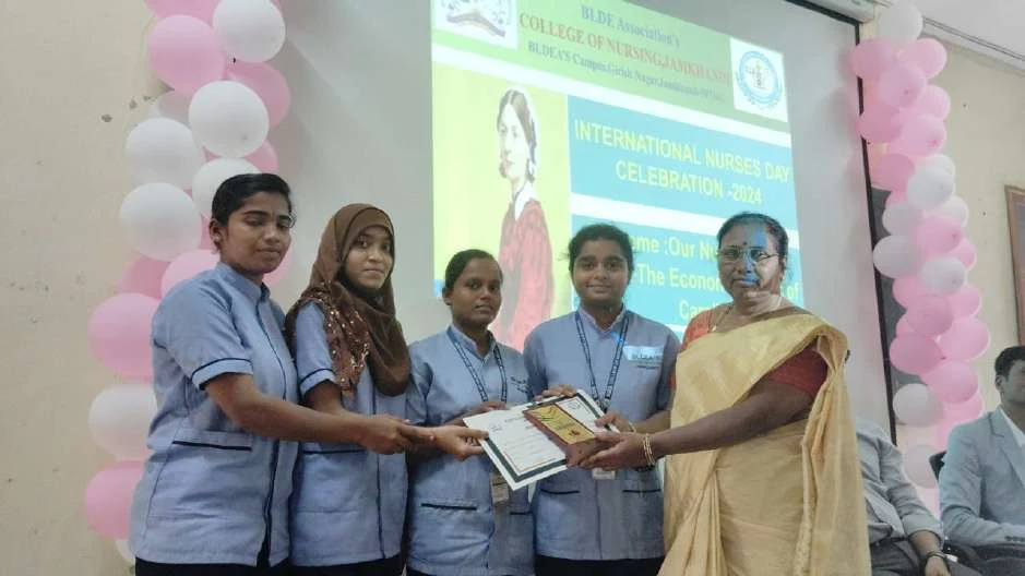 Certificate presentation to female students – International Nurses Day 2024, BLDEA College of Nursing Jamkhandi
