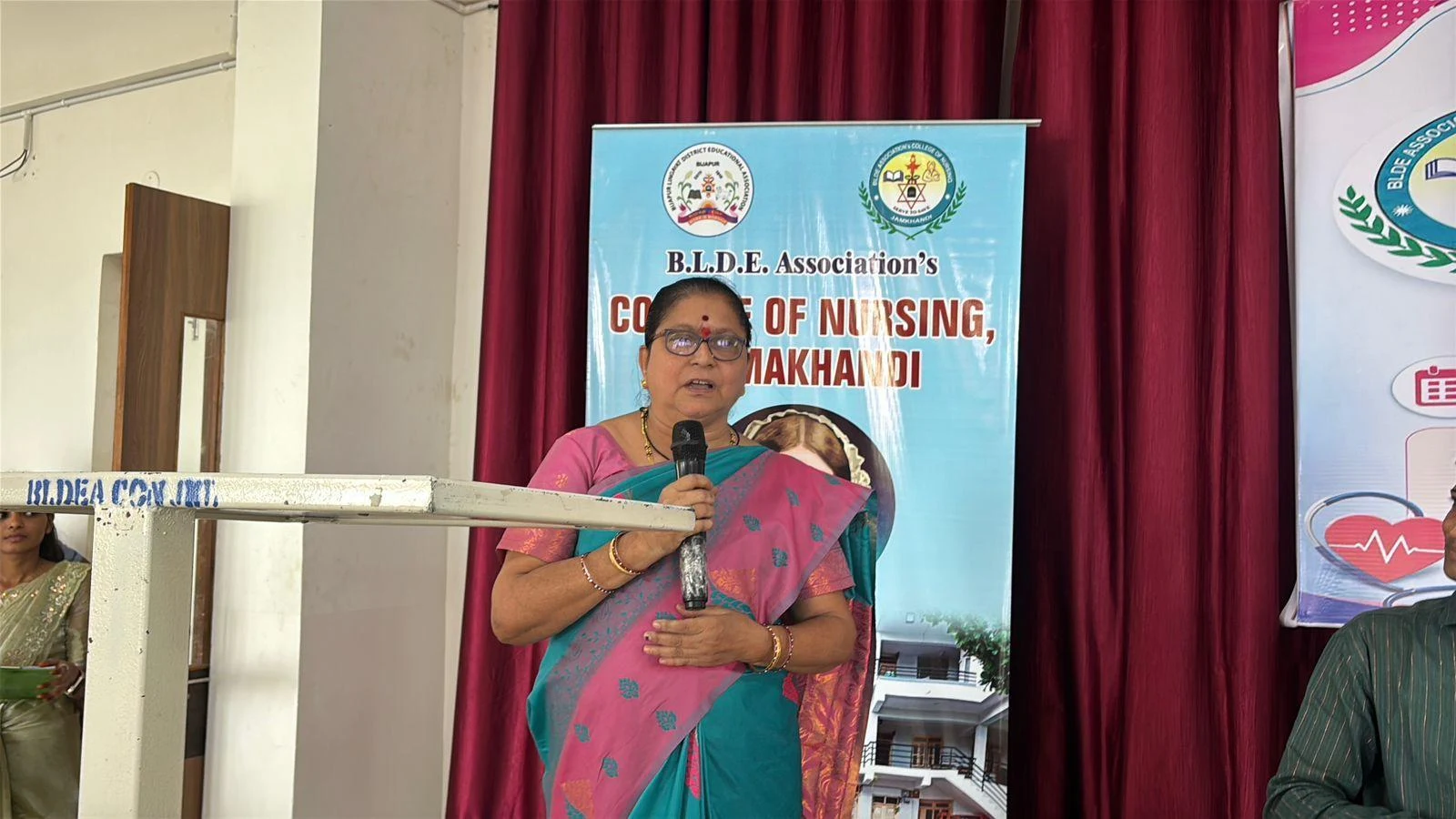 Senior nursing officer addressing the gathering – International Nurses Day 2026, BLDEA College of Nursing Jamkhandi