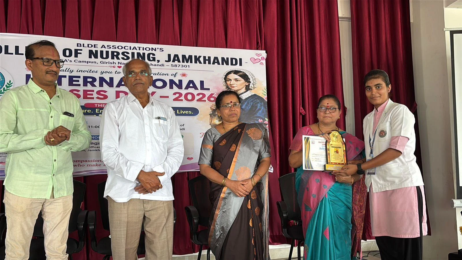 Prize distribution to female student – International Nurses Day 2026, BLDEA College of Nursing Jamkhandi