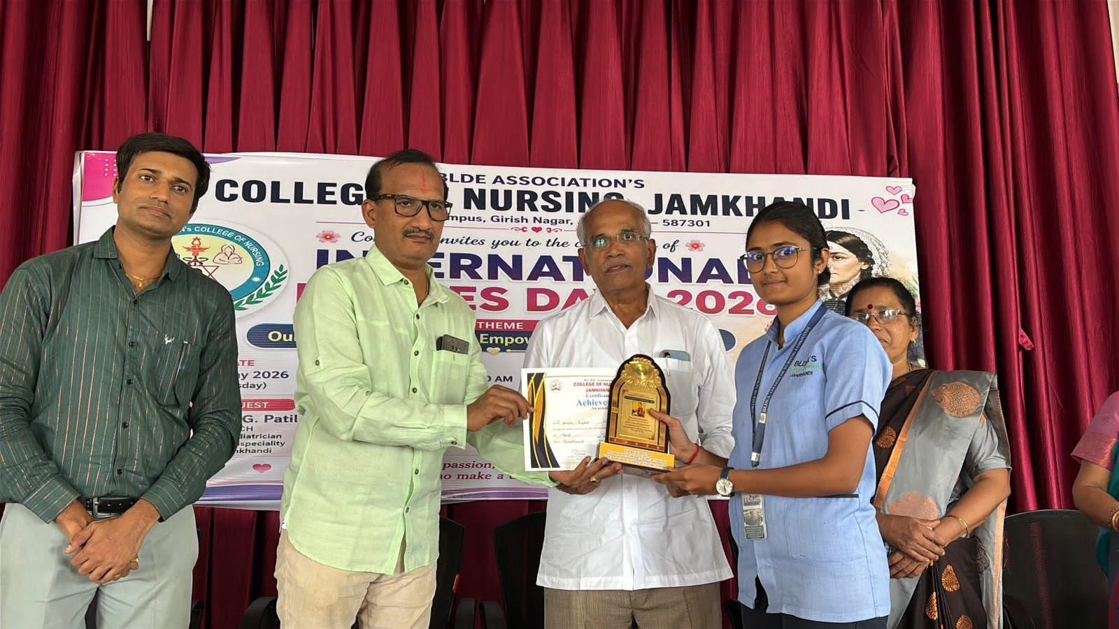 Trophy presentation to student – International Nurses Day 2026, BLDEA College of Nursing Jamkhandi