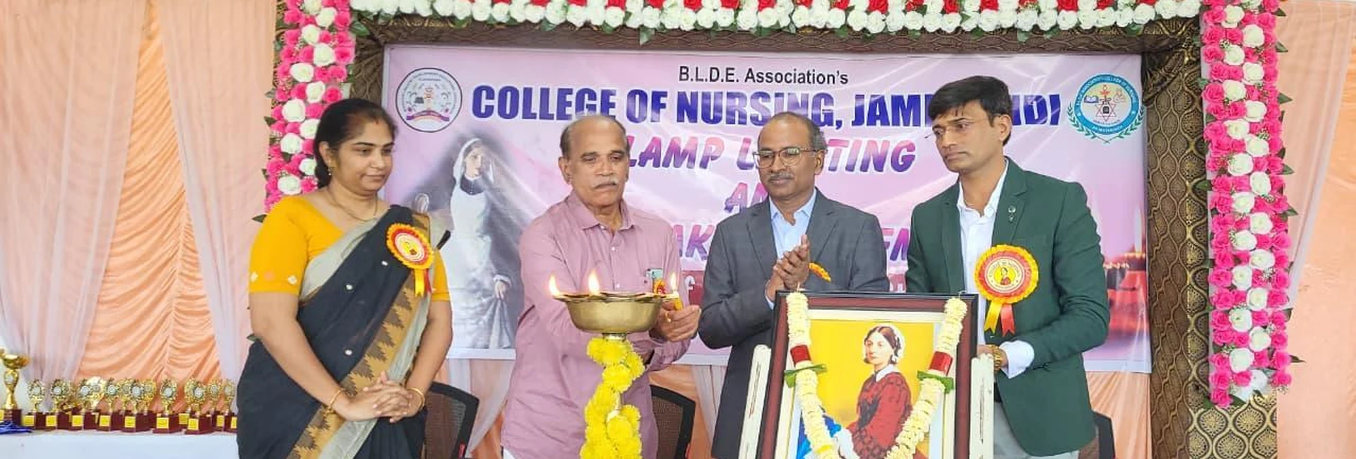 Inaugurator Dr Raveendra Madraki and dignitaries lighting ceremonial lamp at Lamp Lighting and Oath Taking Ceremony 2025 for 4th Batch BSc Nursing students at BLDEA College of Nursing Jamkhandi October 25 2025