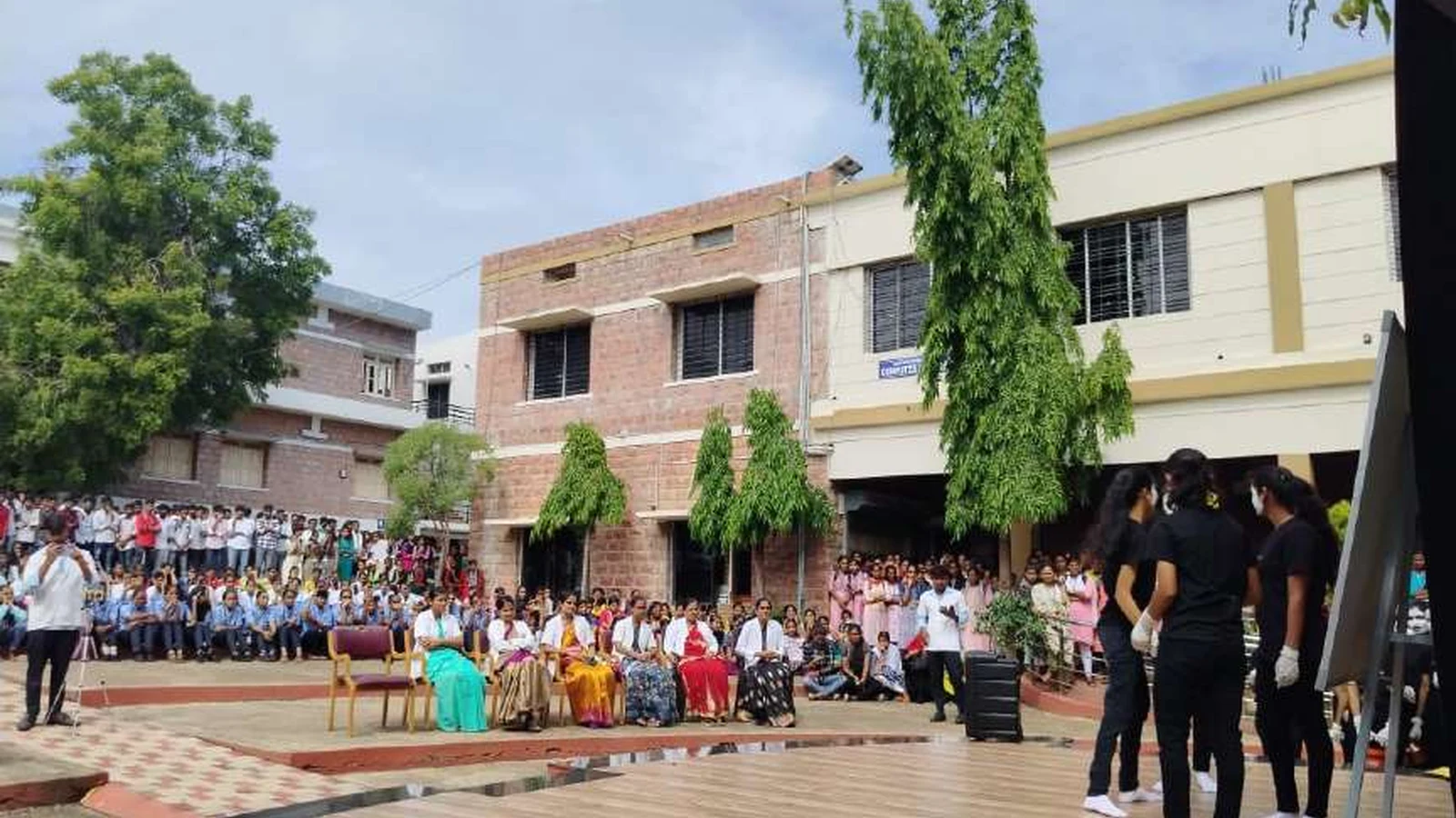 Large audience of more than 350 students and faculty from nursing PU and degree colleges seated on college grounds for World Population Day 2024 mime show organized by BLDEAS College of Nursing Jamkhandi July 11 2024