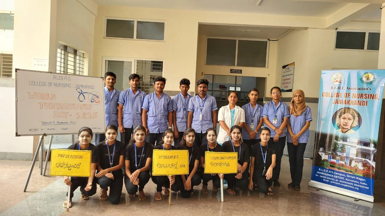 Third semester BSc Nursing students holding placards with TB awareness messages Prevention Awareness Transmission at World Tuberculosis Day 2025 mime show with BLDEAS College of Nursing rollup banner Taluka Hospital Jamkhandi March 25 2025
