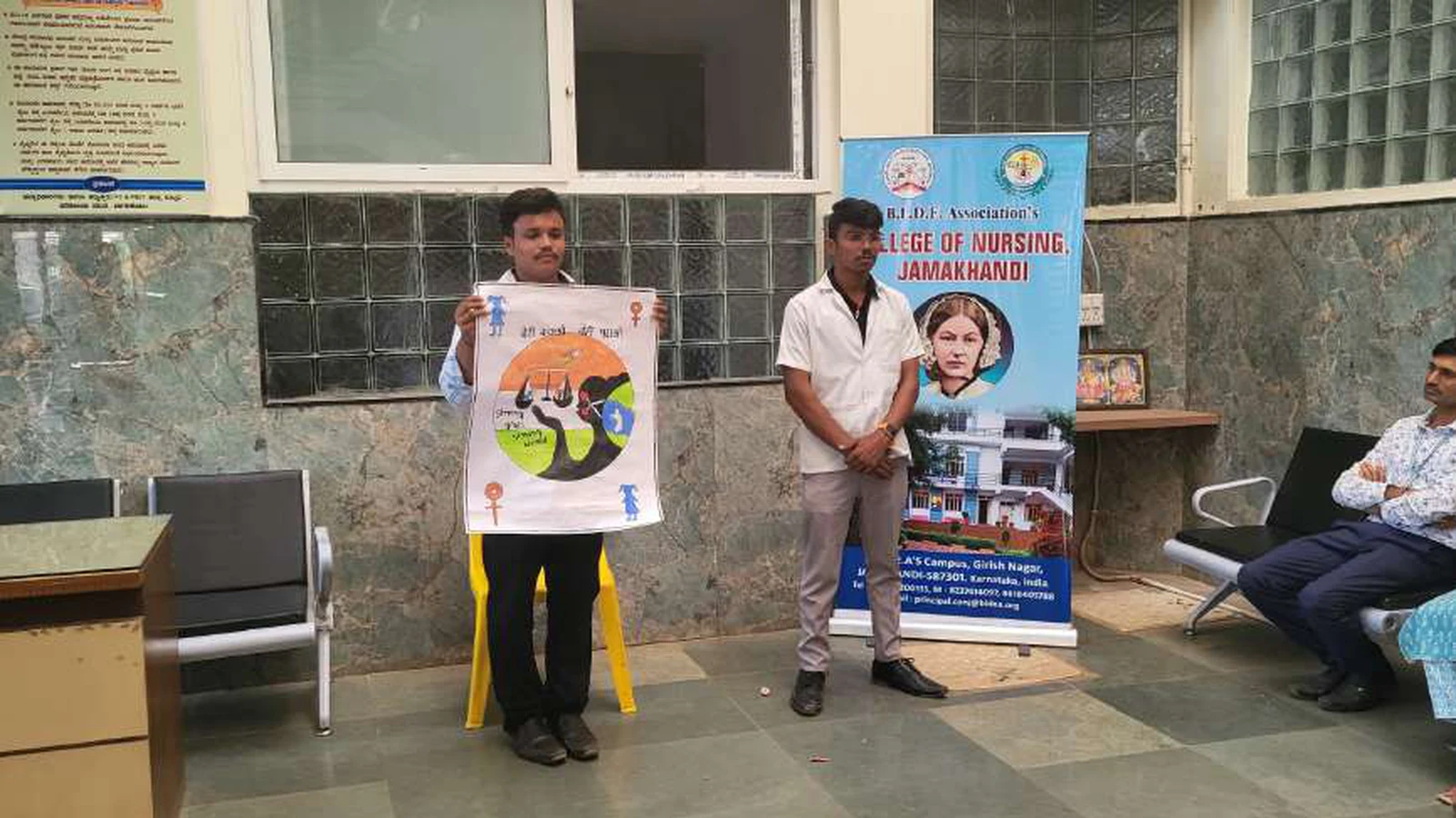 First semester BSc Nursing student presenting girl child awareness poster with BLDEAS College of Nursing Jamkhandi rollup banner at Tungal Hospital during National Girl Child Day awareness program January 24 2024
