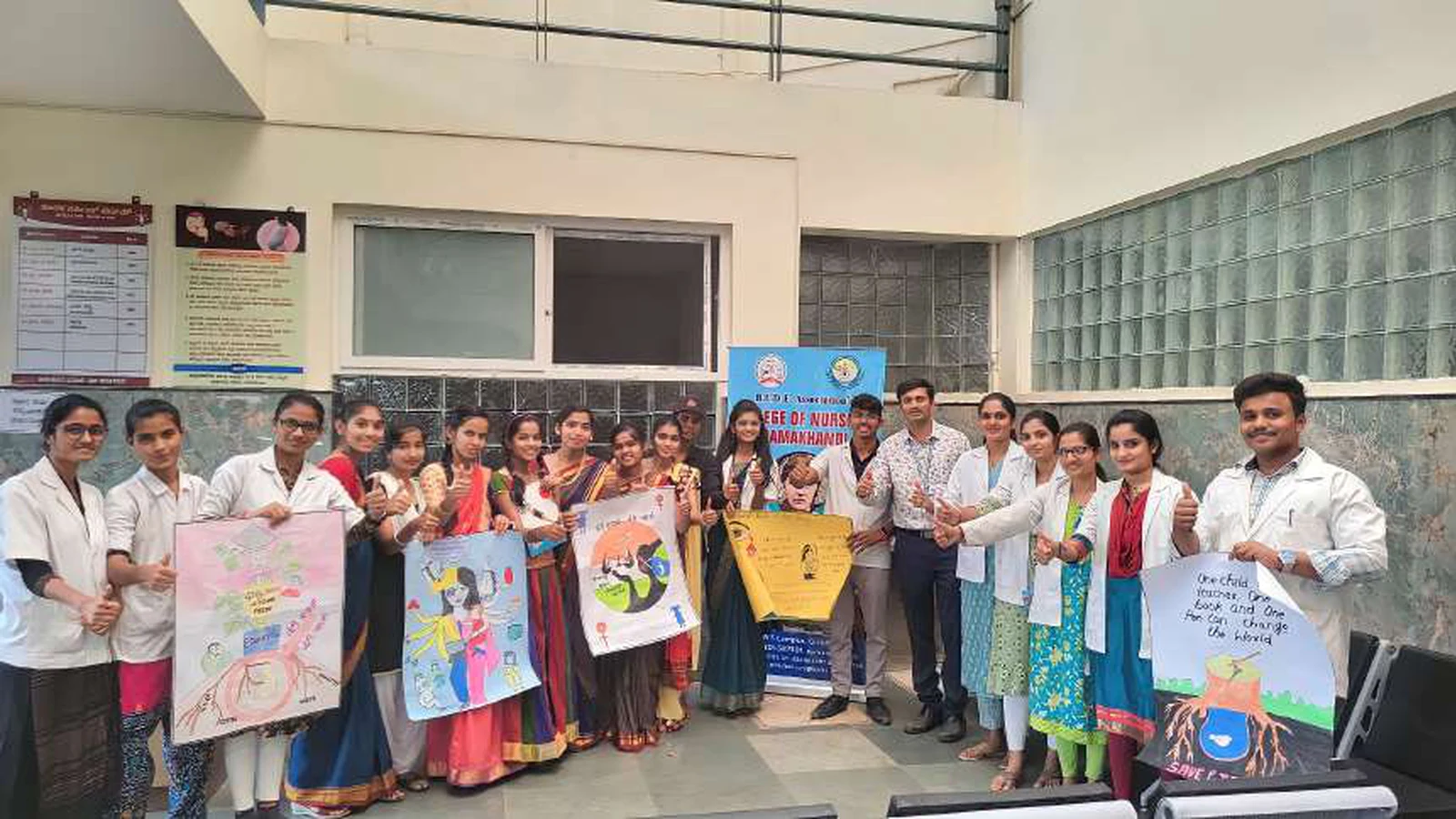 Group photo of first semester BSc Nursing students holding National Girl Child Day awareness posters with BLDEAS College of Nursing Jamkhandi rollup banner at Tungal Hospital January 24 2024