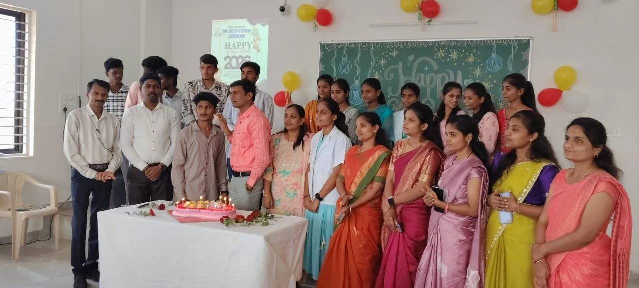 Group at cake table – New Year Celebration 2026, BLDEA College of Nursing Jamkhandi
