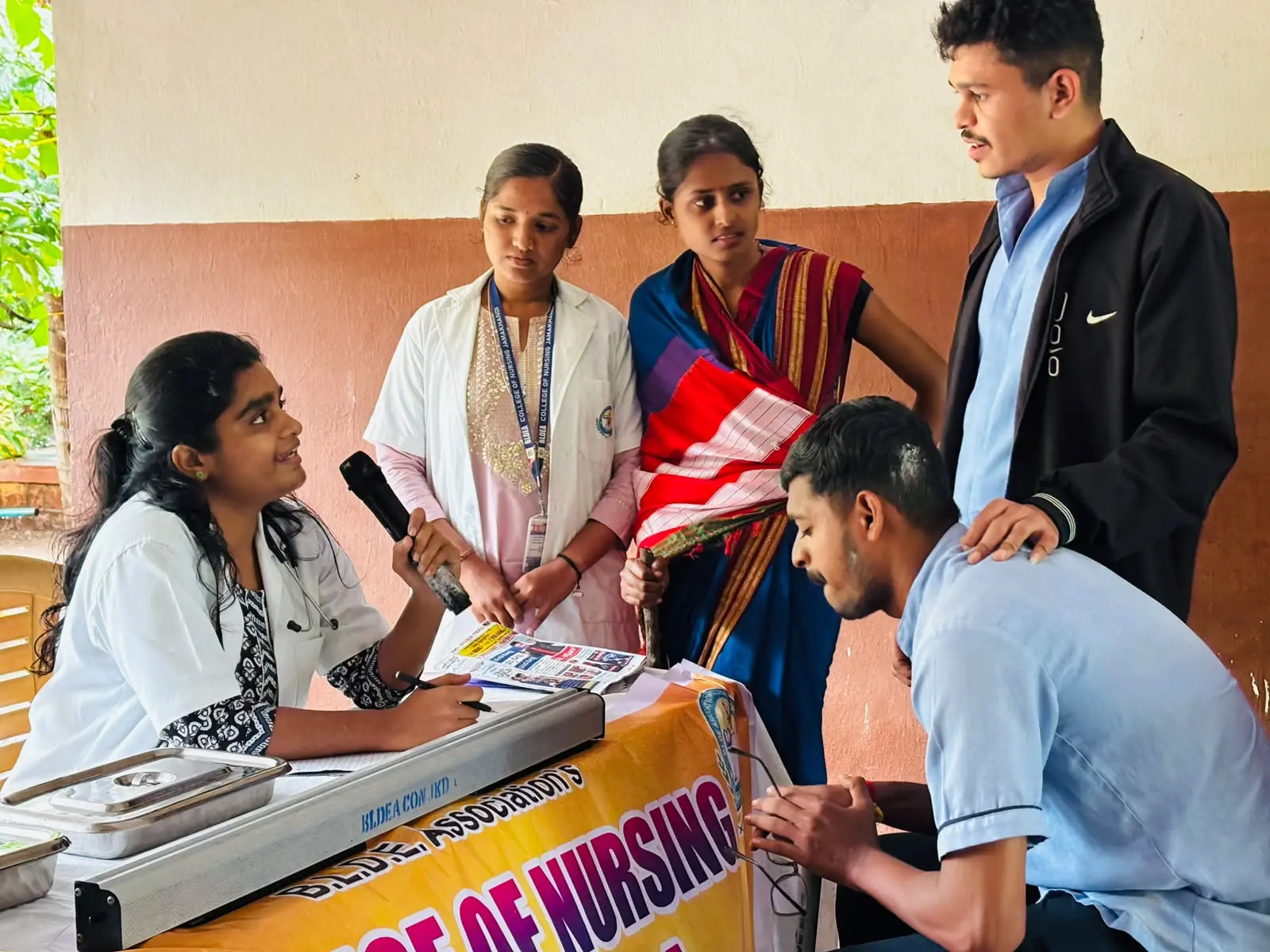 Nursing student conducting health education session on hypertension and diabetes for elderly residents old age home Jamkhandi July 2026