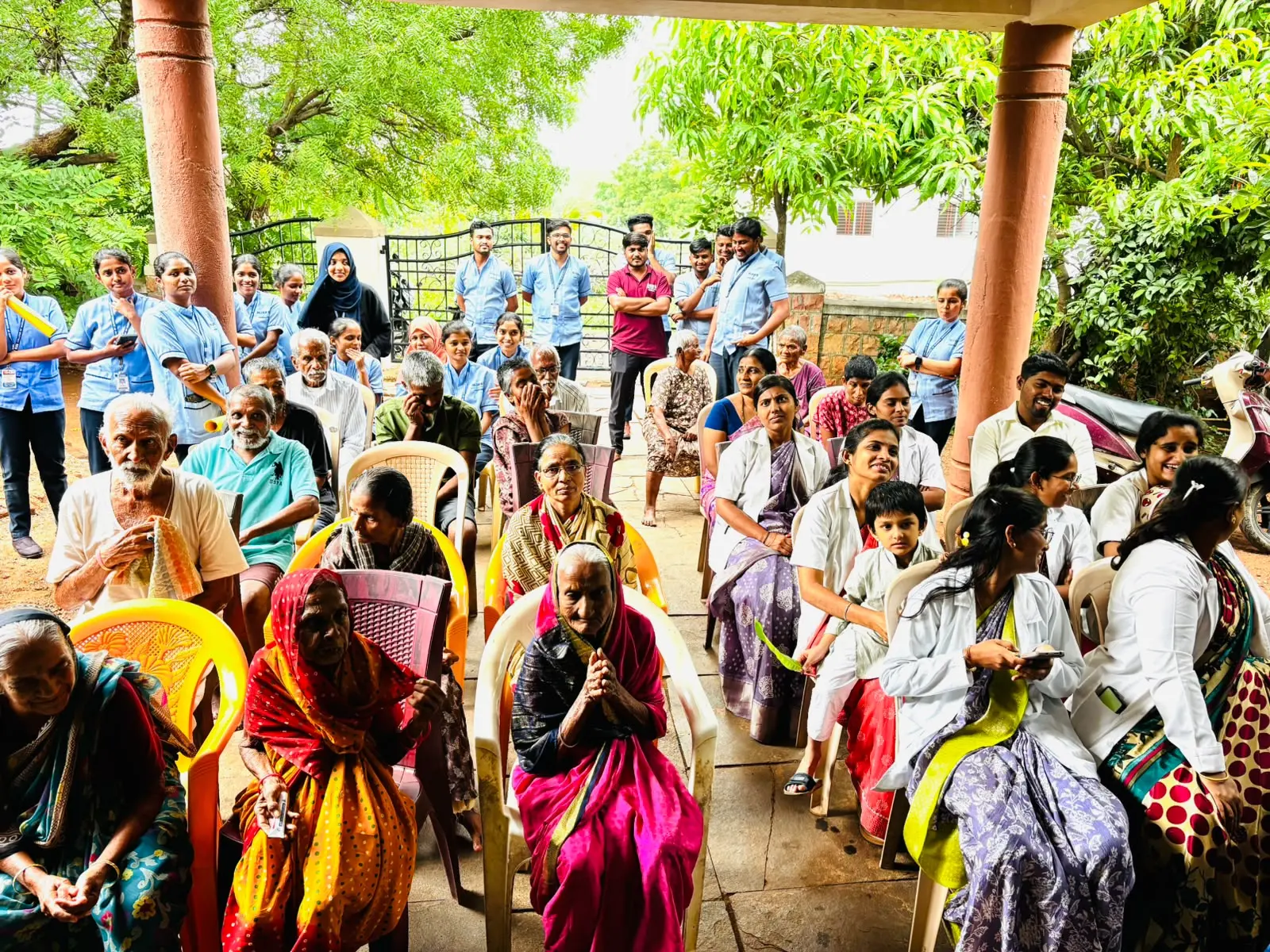 Elderly residents having lunch prepared and served by BLDEA College of Nursing students at old age home Jamkhandi