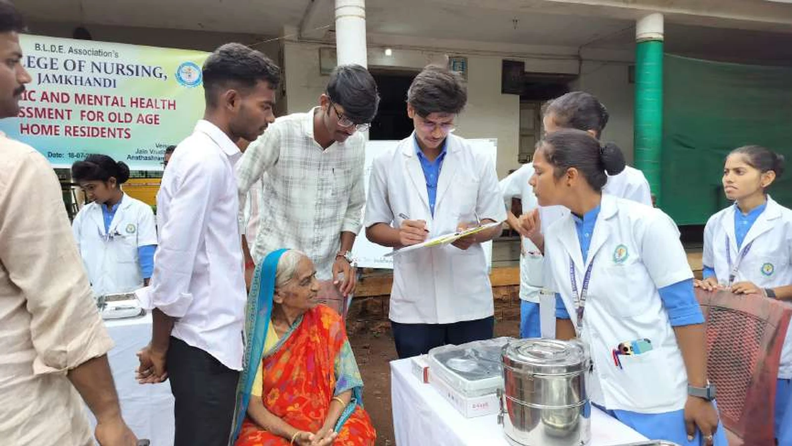 Third year BSc Nursing students of BLDEAS College of Nursing Jamkhandi conducting geriatric and mental health assessment for old age home residents at Jain Vrudhrashram Jamkhandi with BLDEAS Geriatric and Mental Health Assessment banner visible July 18 2024