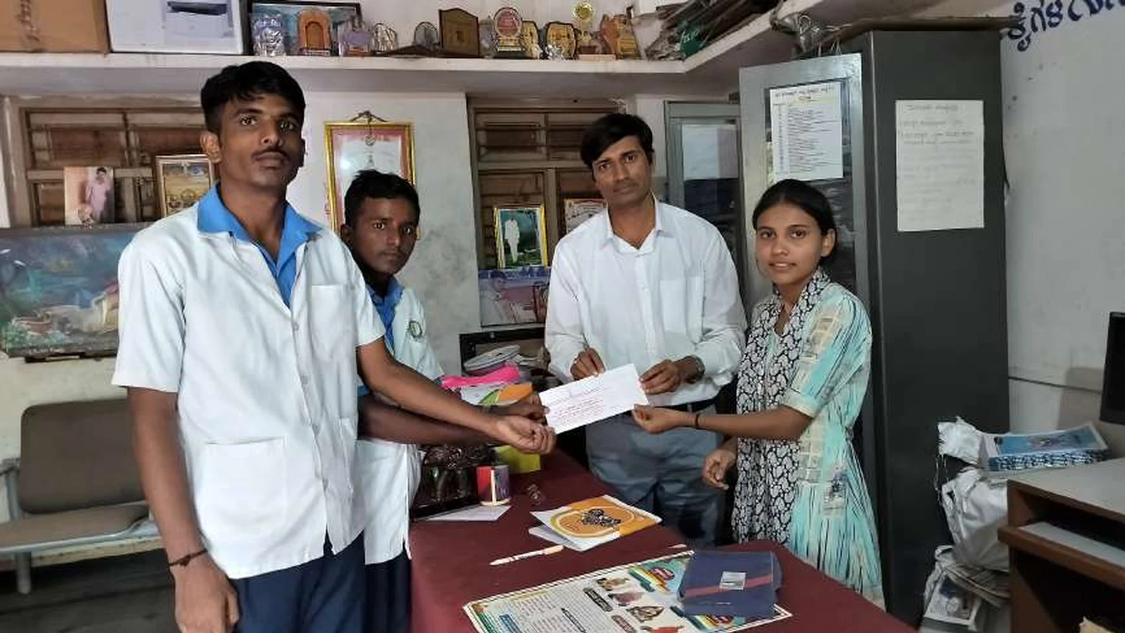 Third year BSc Nursing students of BLDEAS College of Nursing Jamkhandi presenting donation to management of Jain Vrudhrashram Jamkhandi from Dr Veerabhadrappa Mendagudli Mr Shantappa and Mr Mahesh July 18 2024