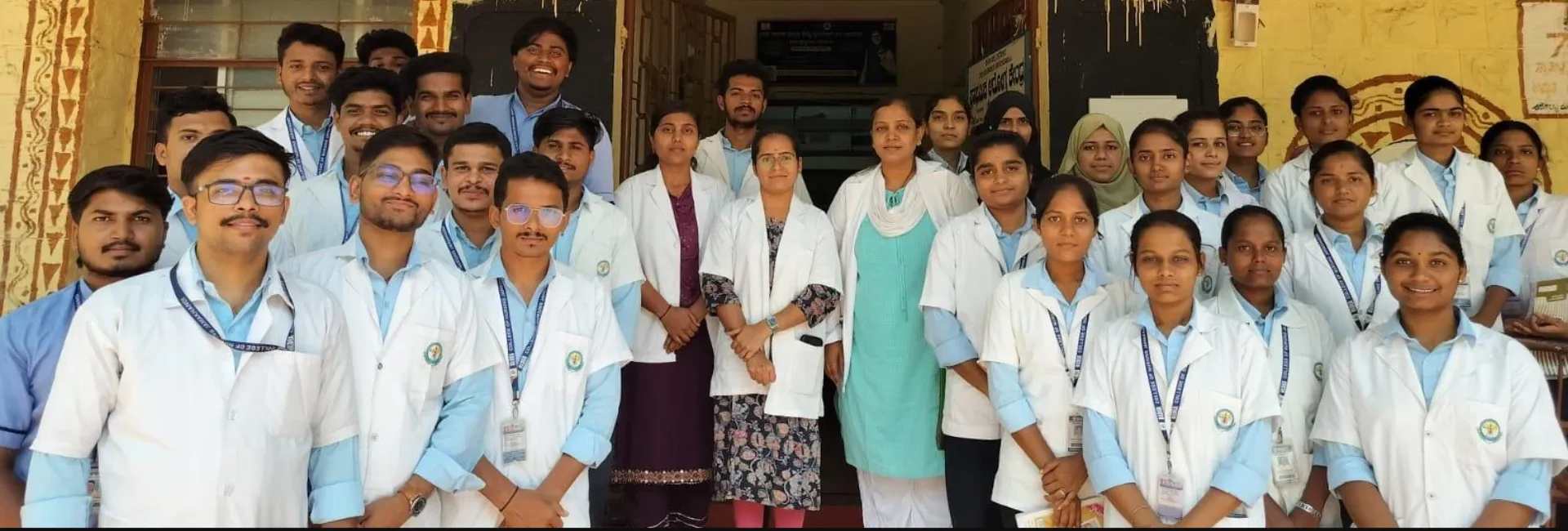 Seventh Semester BSc Nursing Students BLDEA College of Nursing Jamkhandi group photo at Primary Health Centre PHC Konnur entrance during Community Health Nursing Educational Visit June 2026