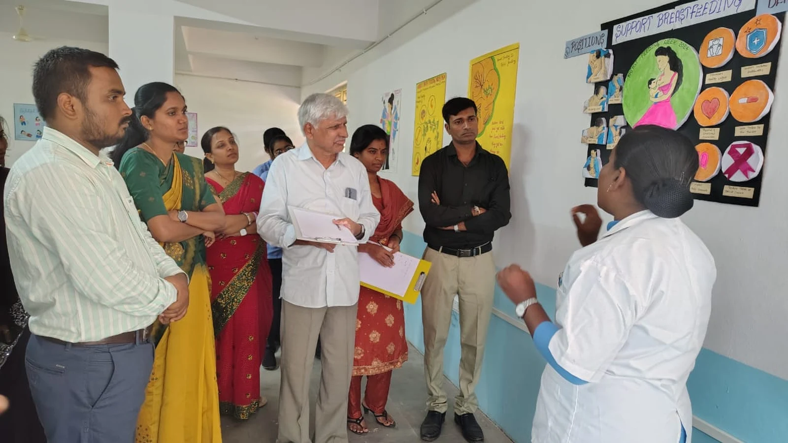 Group of judges faculty and BSc Nursing students of BLDEAS College of Nursing Jamkhandi evaluating SUPPORT BREASTFEEDING themed poster at World Breastfeeding Week Poster Competition August 7 2024