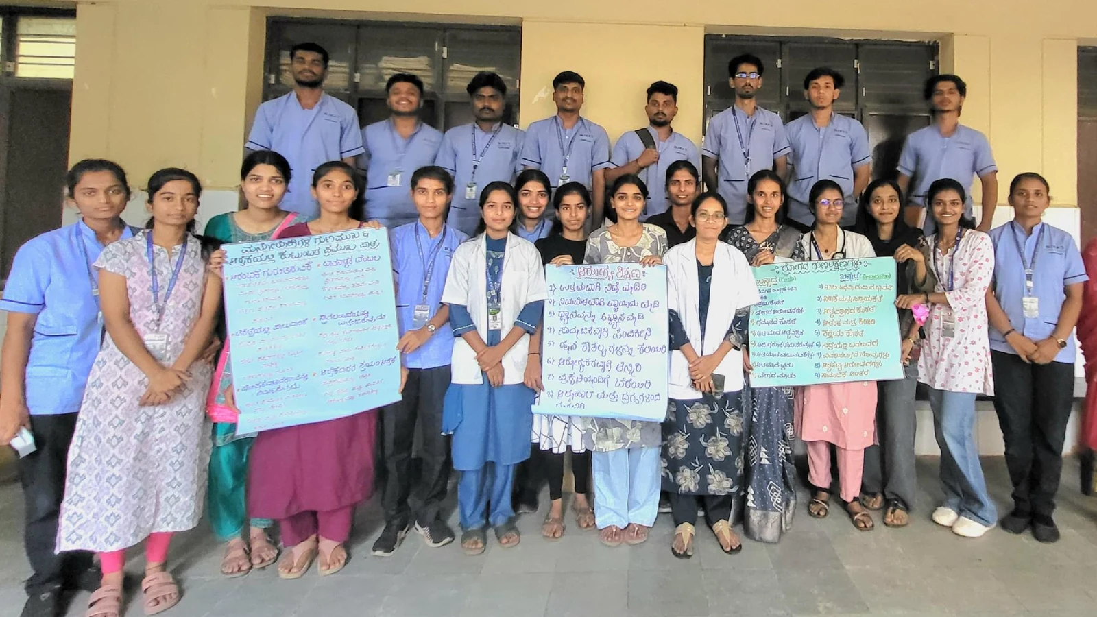 BLDEA College of Nursing Jamkhandi Fifth Semester BSc Nursing students with case study chart papers and process recording documents at DIMHANS Dharwad during Psychiatric Clinical Posting May 2026