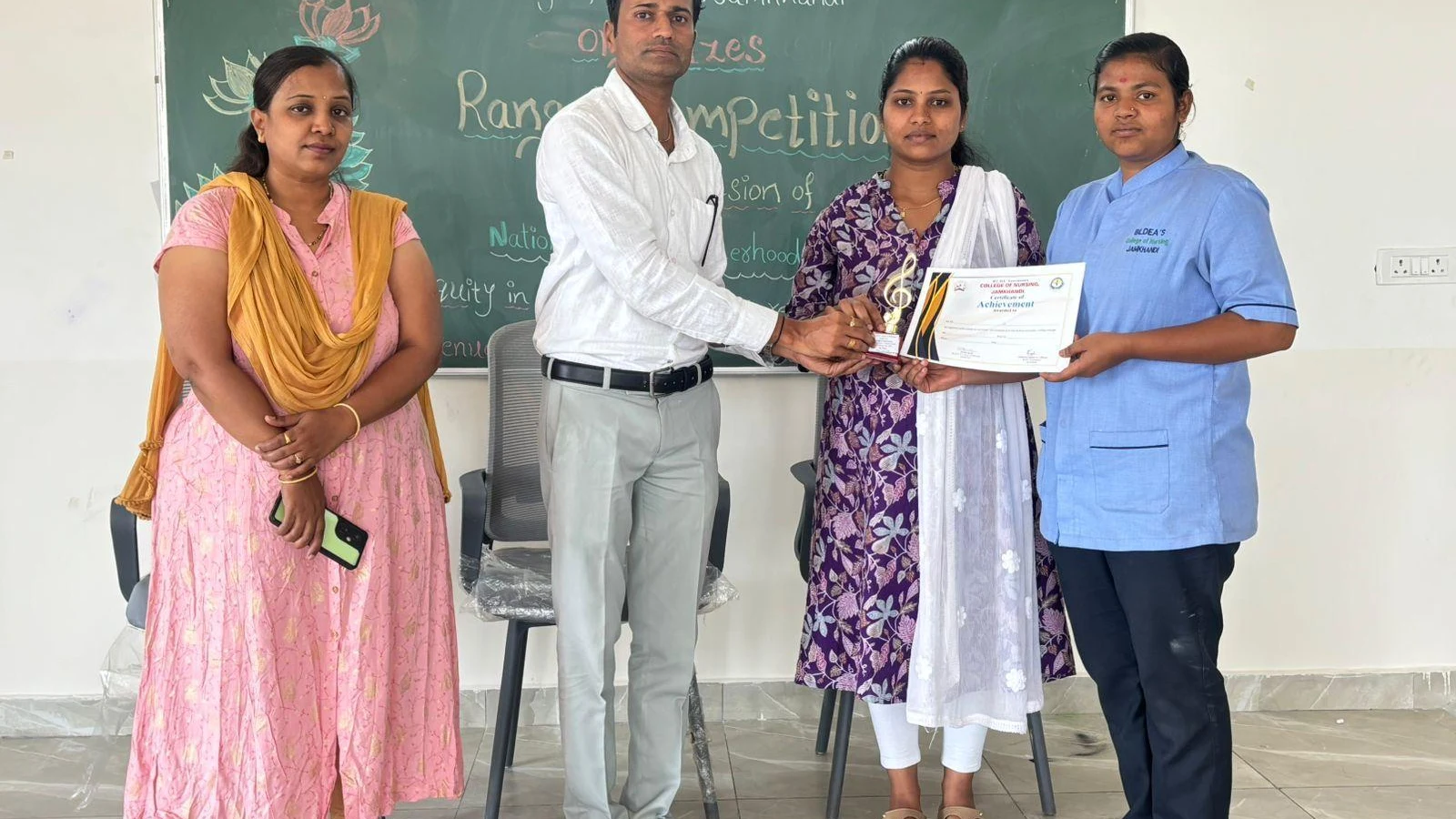 Prize distribution at National Safe Motherhood Day Rangoli Competition 2026 – BLDEA College of Nursing Jamkhandi
