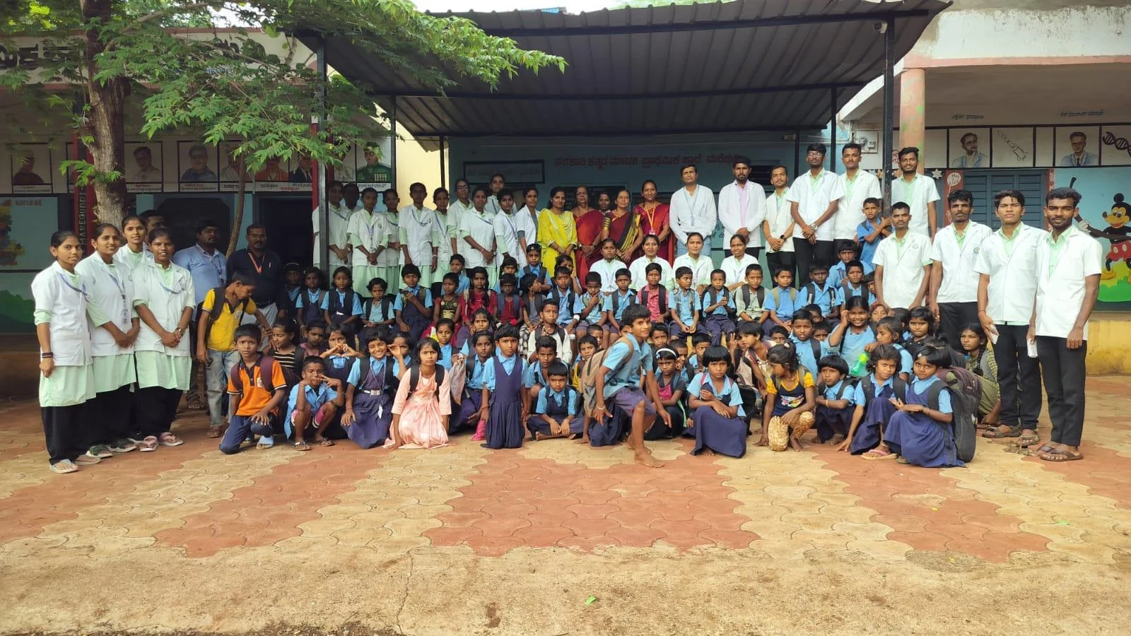 Group photo of final year BSc Nursing students faculty and school children at Government Primary School Mareguddi after completion of School Health Program organized by BLDEAS College of Nursing Jamkhandi under guidance of Dr Veerabhadrappa Mendagudli Principal June 13 2025