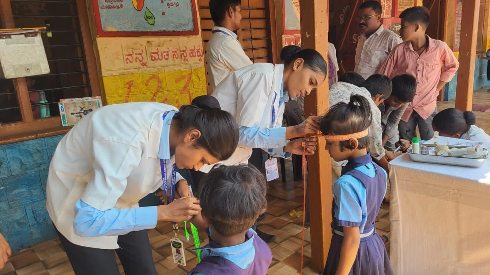 Fifth Semester BSc Nursing students BLDEA College of Nursing Jamkhandi conducting growth monitoring nutritional assessment height weight measurement for school children at Government Primary School Kakanwadi June 2026
