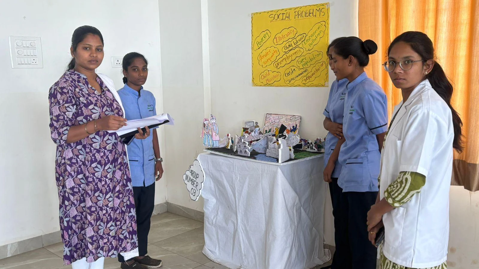 Faculty evaluating Group III Social Problems model at Sociology Psychology Exhibition – BLDEA College of Nursing Jamkhandi