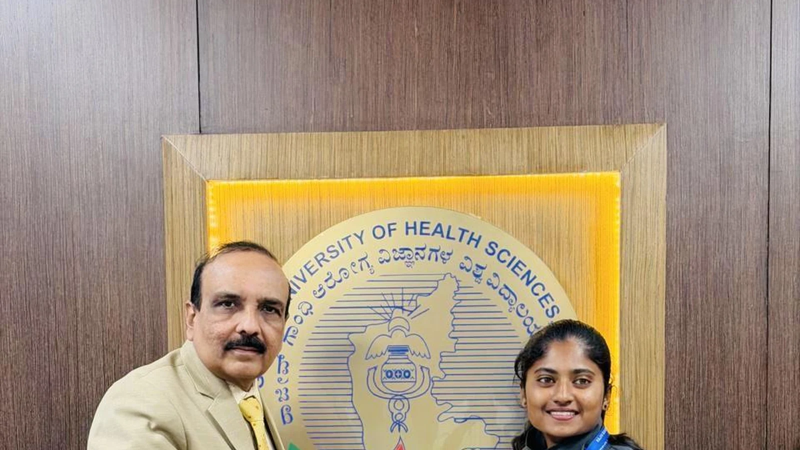 RGUHS Vice-Chancellor Bhagawan B. C. presenting University Blue Honour certificate to Ms. Vandana H. Chikaraddi BSc Nursing BLDEA College of Nursing Jamkhandi