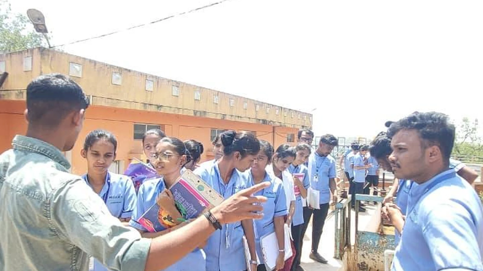 Mr. Sunil Ballur explaining water purification process to B.Sc. Nursing students at water treatment channel – BLDEA College of Nursing Jamkhandi