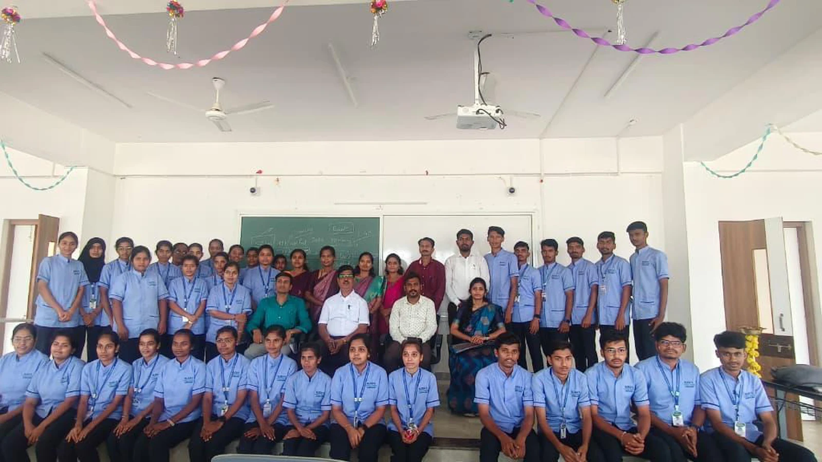 Group photograph of all participants including Second Semester BSc Nursing students faculty and resource persons at Workshop on Digital Literacy for Health Care BLDEA College of Nursing Jamkhandi Seminar Hall with colourful paper decorations November 10 2025