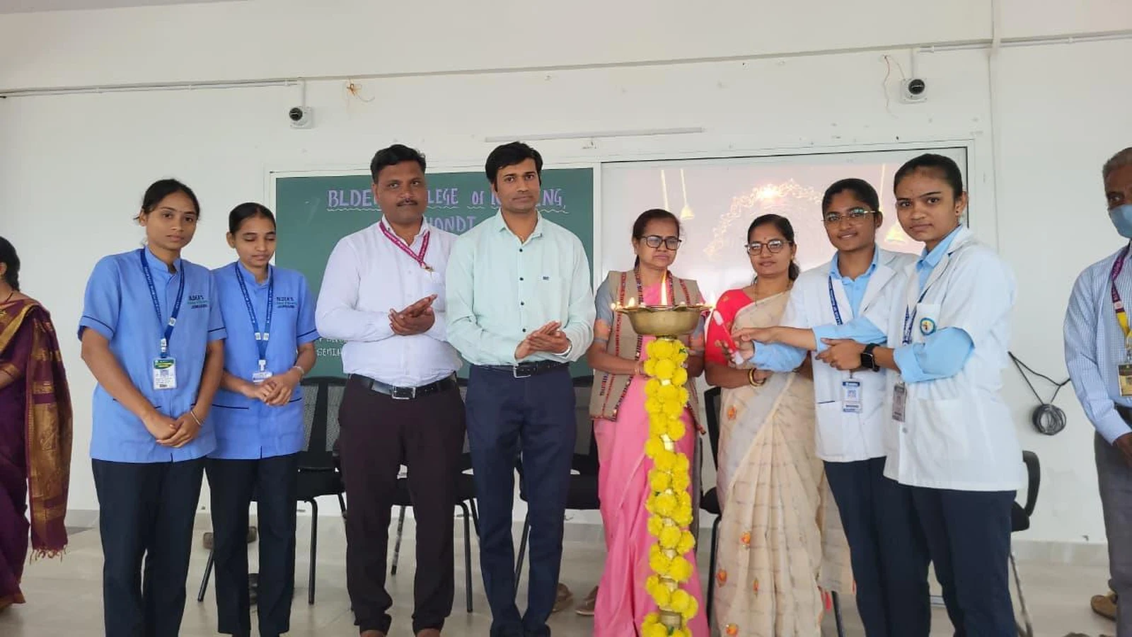 Wider view of ceremonial lamp lighting with students and faculty at inauguration of Workshop on Transforming Teaching Classroom Outcomes through Cognitive Levels and Innovative Strategies at BLDEA College of Nursing Jamkhandi October 4 2025
