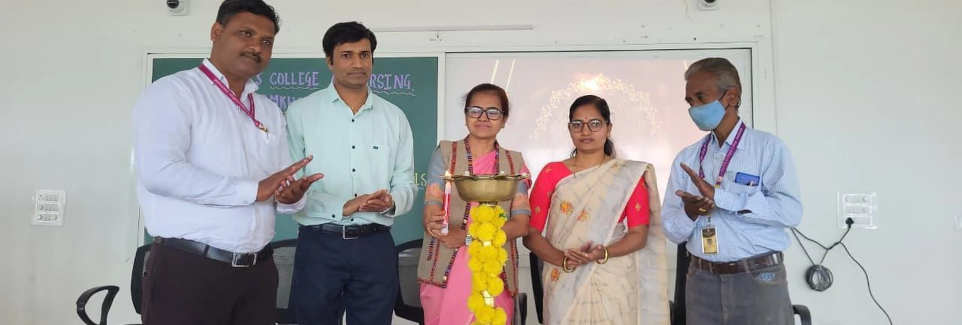 Dignitaries and nursing students lighting ceremonial lamp at inauguration of Workshop on Transforming Teaching Classroom Outcomes through Cognitive Levels and Innovative Strategies at BLDEA College of Nursing Jamkhandi October 4 2025