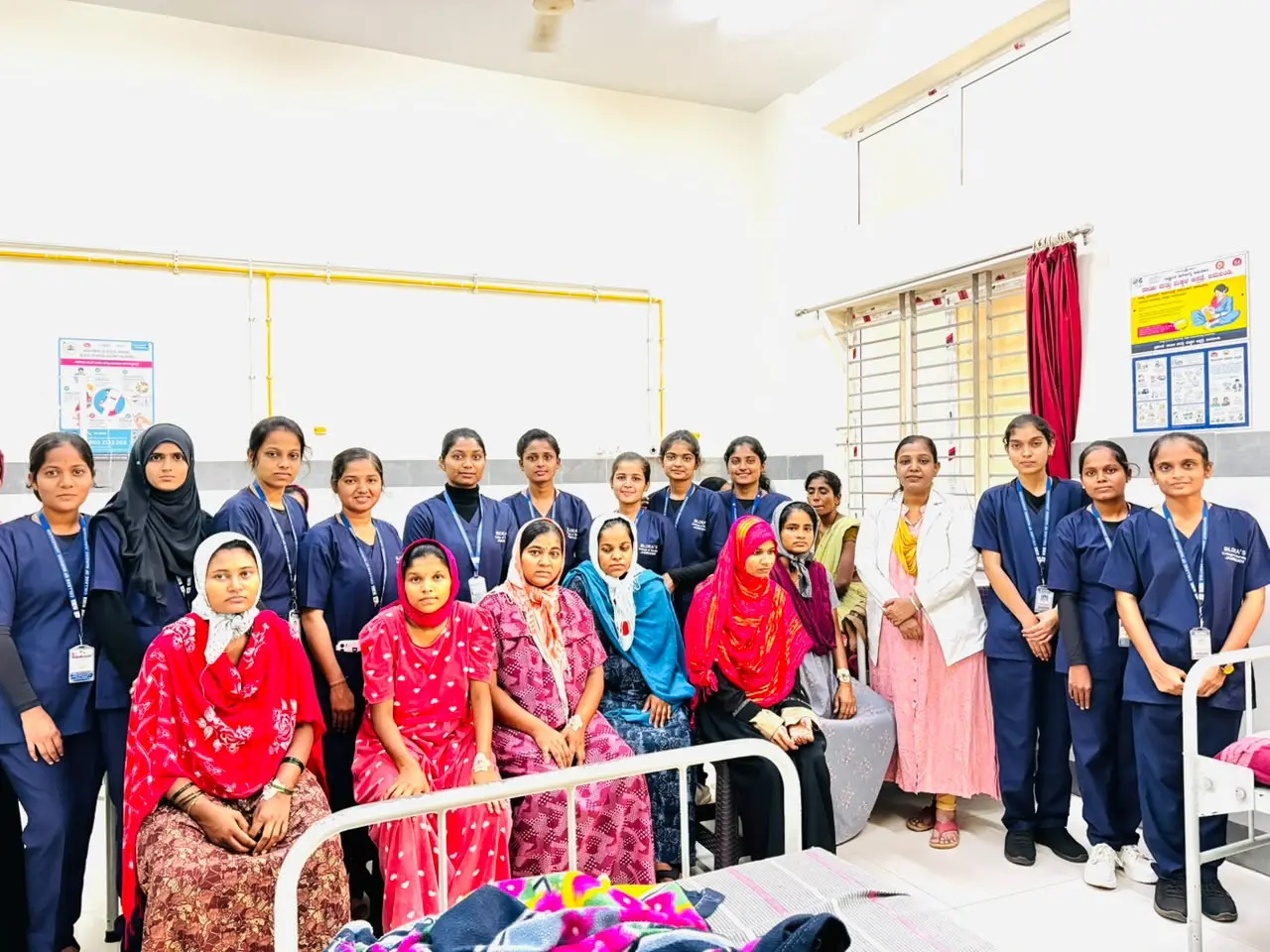 Nursing students using poster to teach exclusive breastfeeding importance to mothers Government Hospital Jamkhandi World Breastfeeding Week